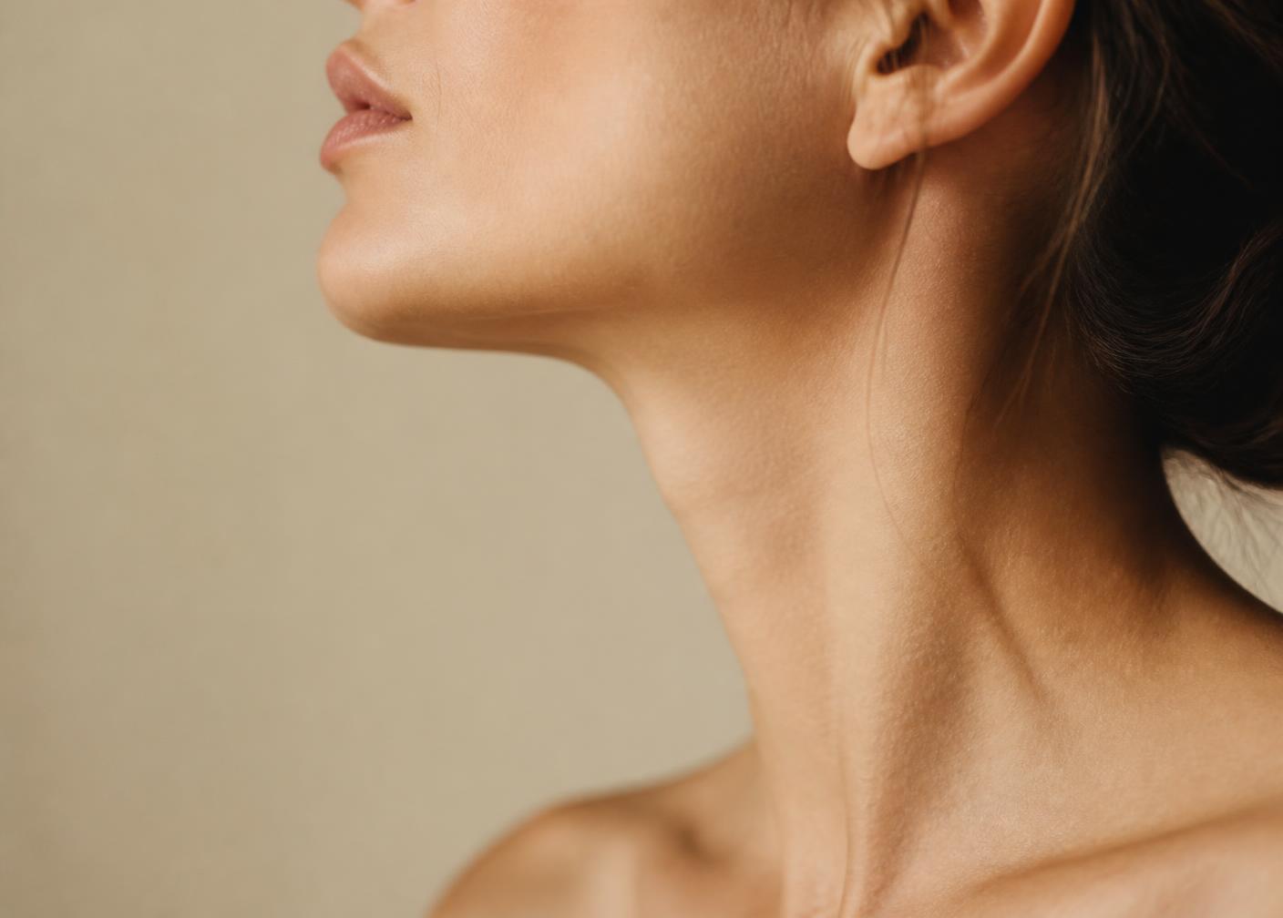 Editorial profile portrait highlighting a refined chin and neck